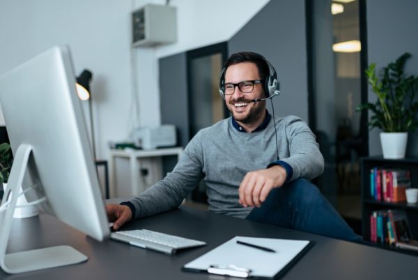 handsome casual businessman talking online via headset picture id1064570004