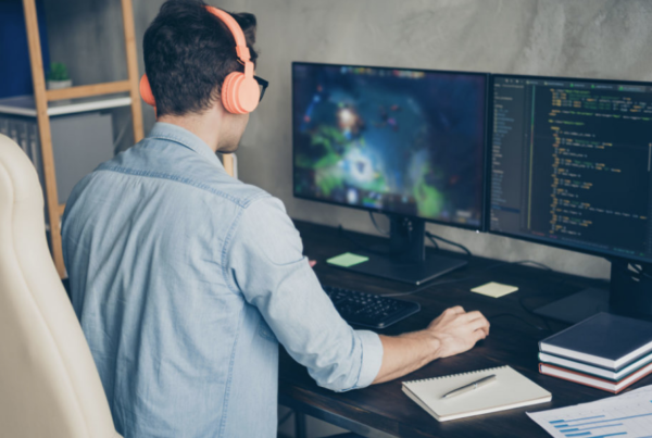 A man working from home using two monitors